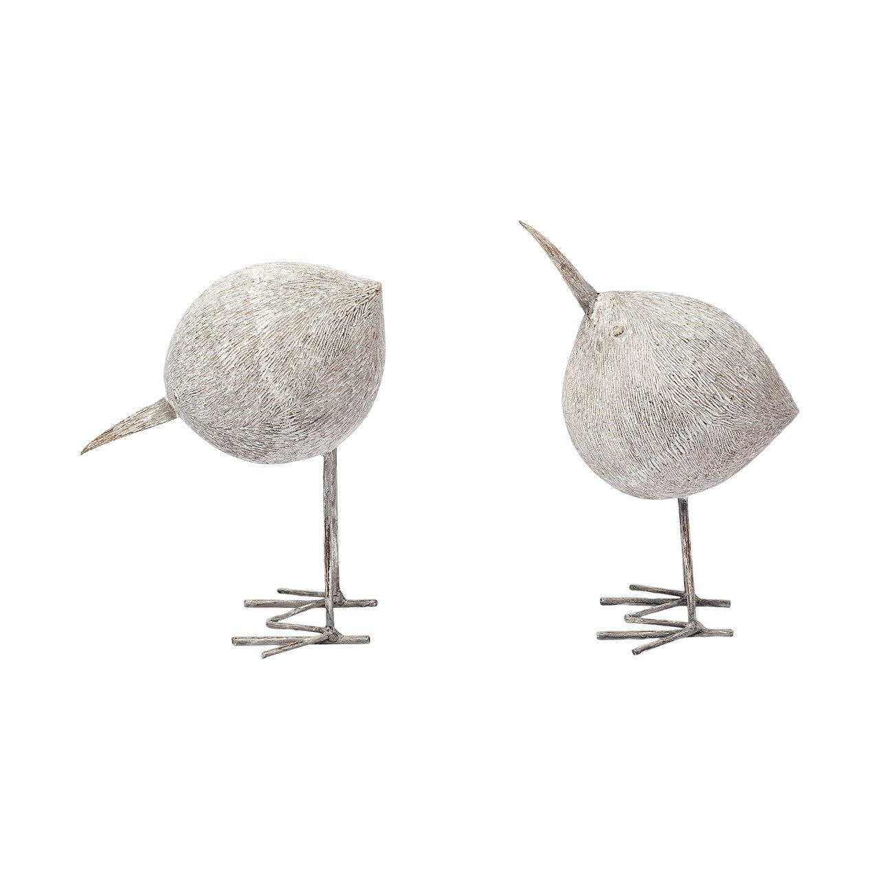 Two minimalist white bird sculptures on a white background.