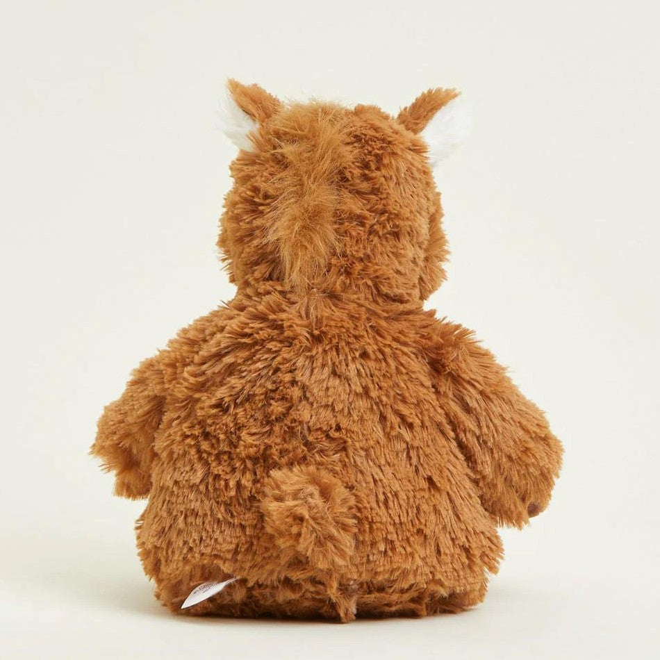 Fluffy plush toy animal seen from the back.