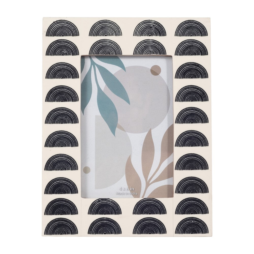 Decorative photo frame with geometric patterns and abstract art inside.
