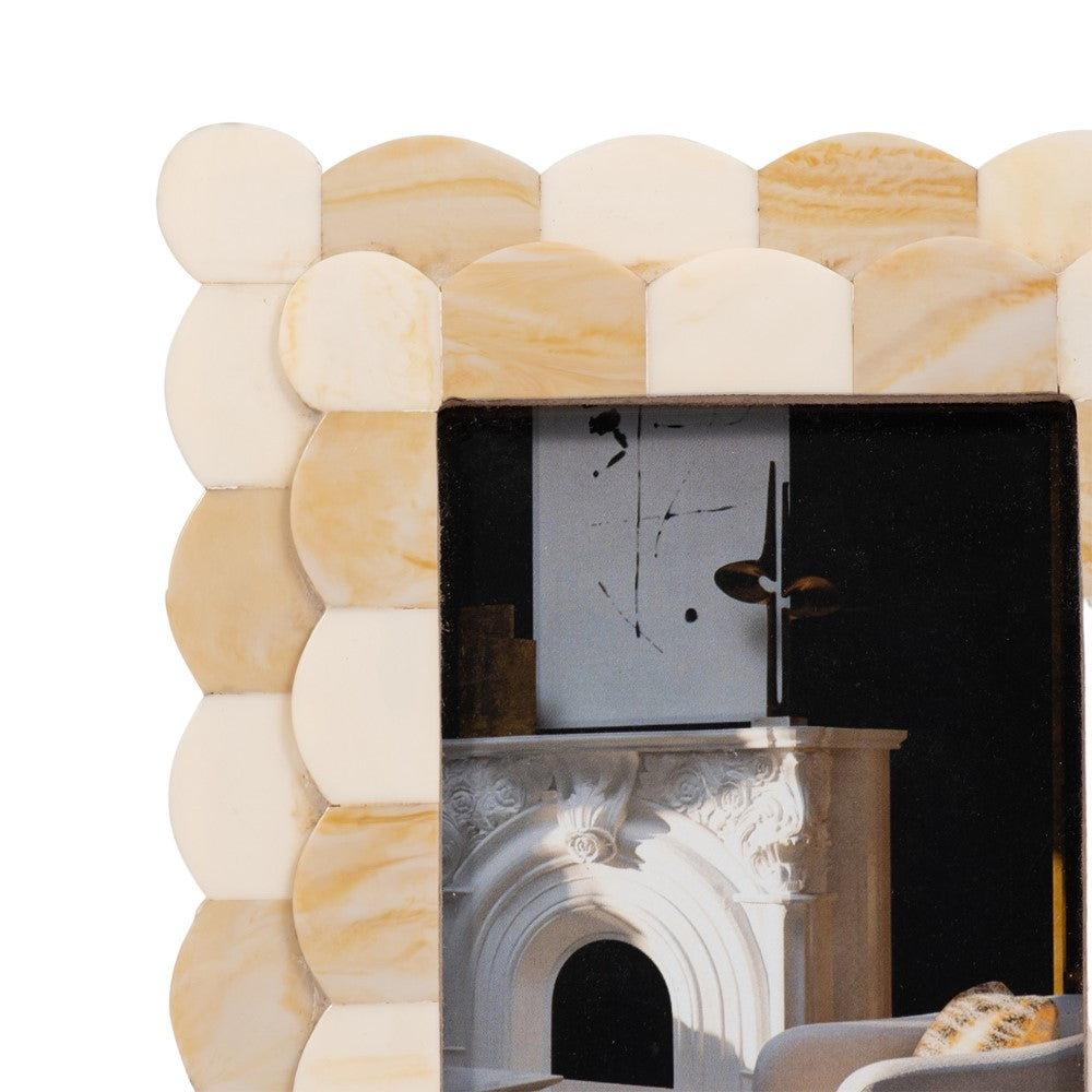 White marble-patterned photo frame with a decorative interior scene.