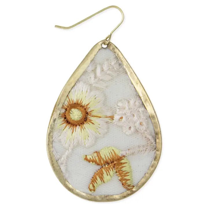 Teardrop earring with floral embroidery in soft colors.