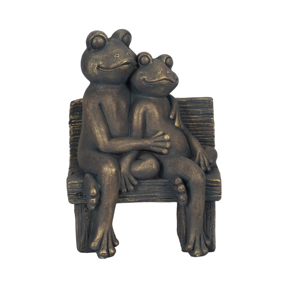 Two frog statues cuddling on a bench.