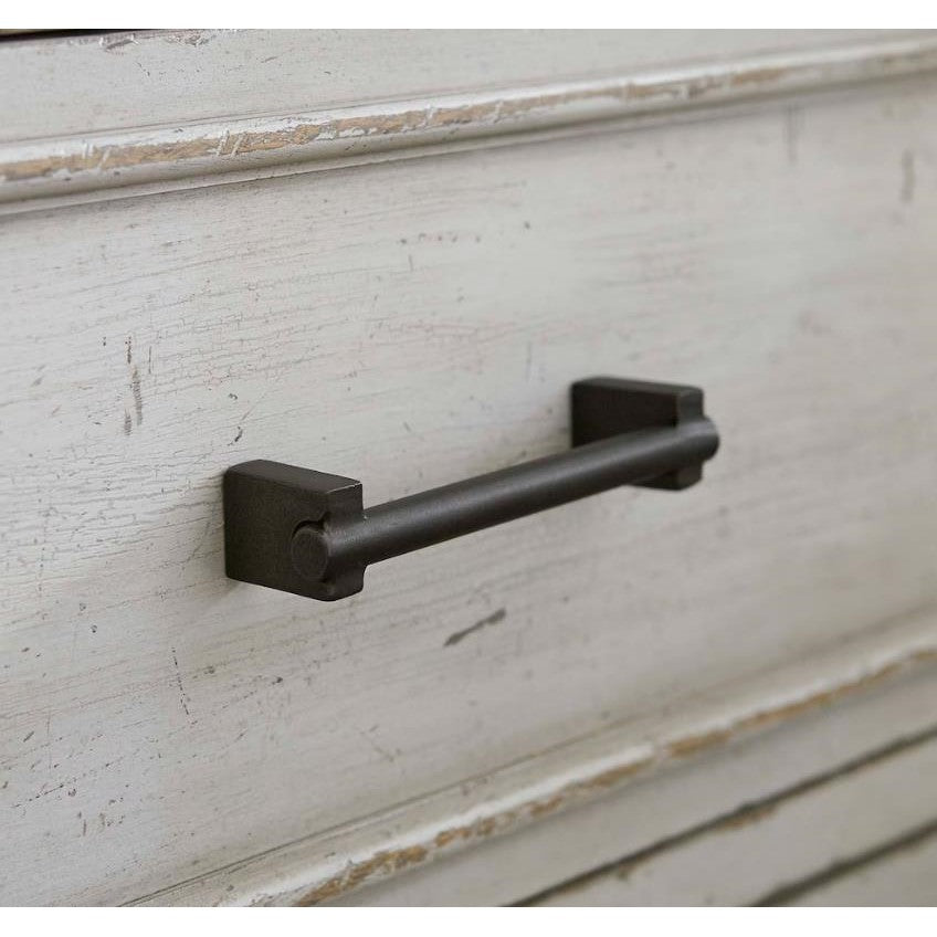 Rustic drawer pull on a weathered wooden surface.