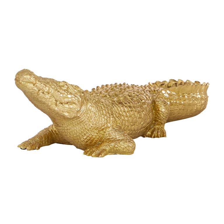 Golden crocodile sculpture on a plain white background.