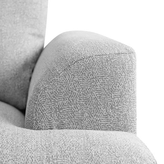 Gray fabric armchair close-up, textured upholstery.