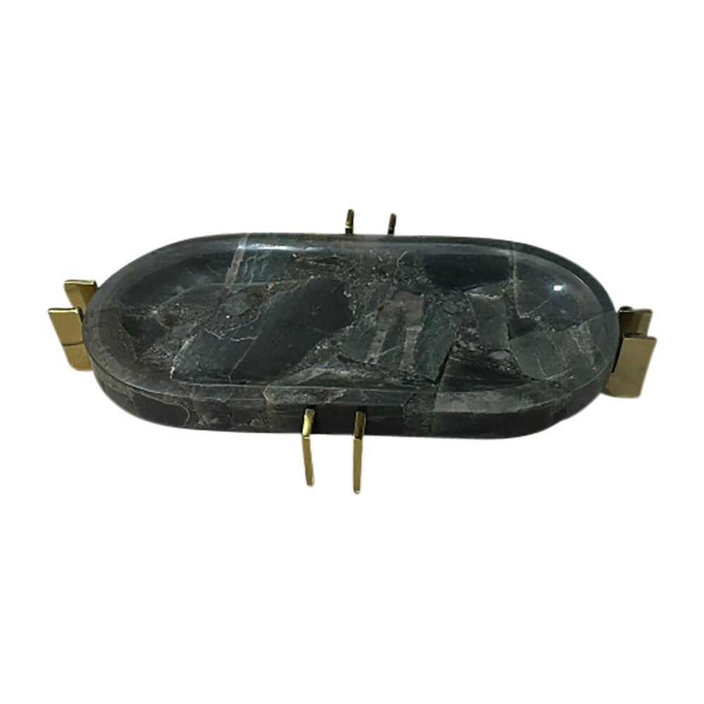 Oval polished stone dish with gold accents.