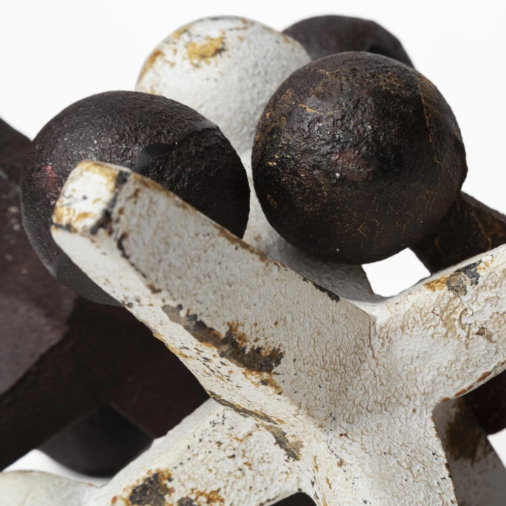 Close-up of rusted metal industrial gears and spheres.