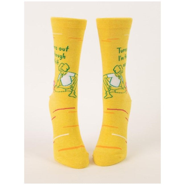 Yellow socks with a cartoon and text design.