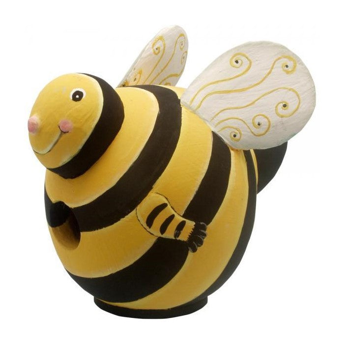 Cute, round bee sculpture with swirly wings and a smiling face.