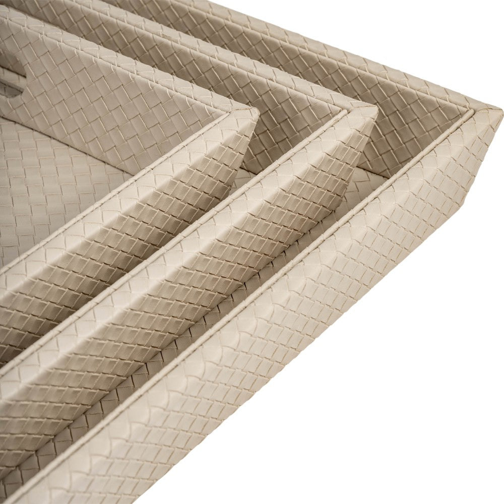 Woven beige trays stacked neatly in a row.