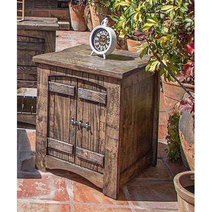 Rustic wooden cabinet on a tiled patio with foliage and a decorative clock.