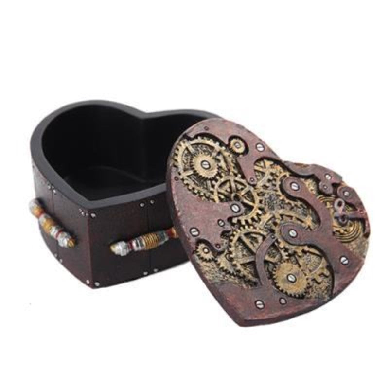 Heart-shaped box with gears, open lid, steampunk design.