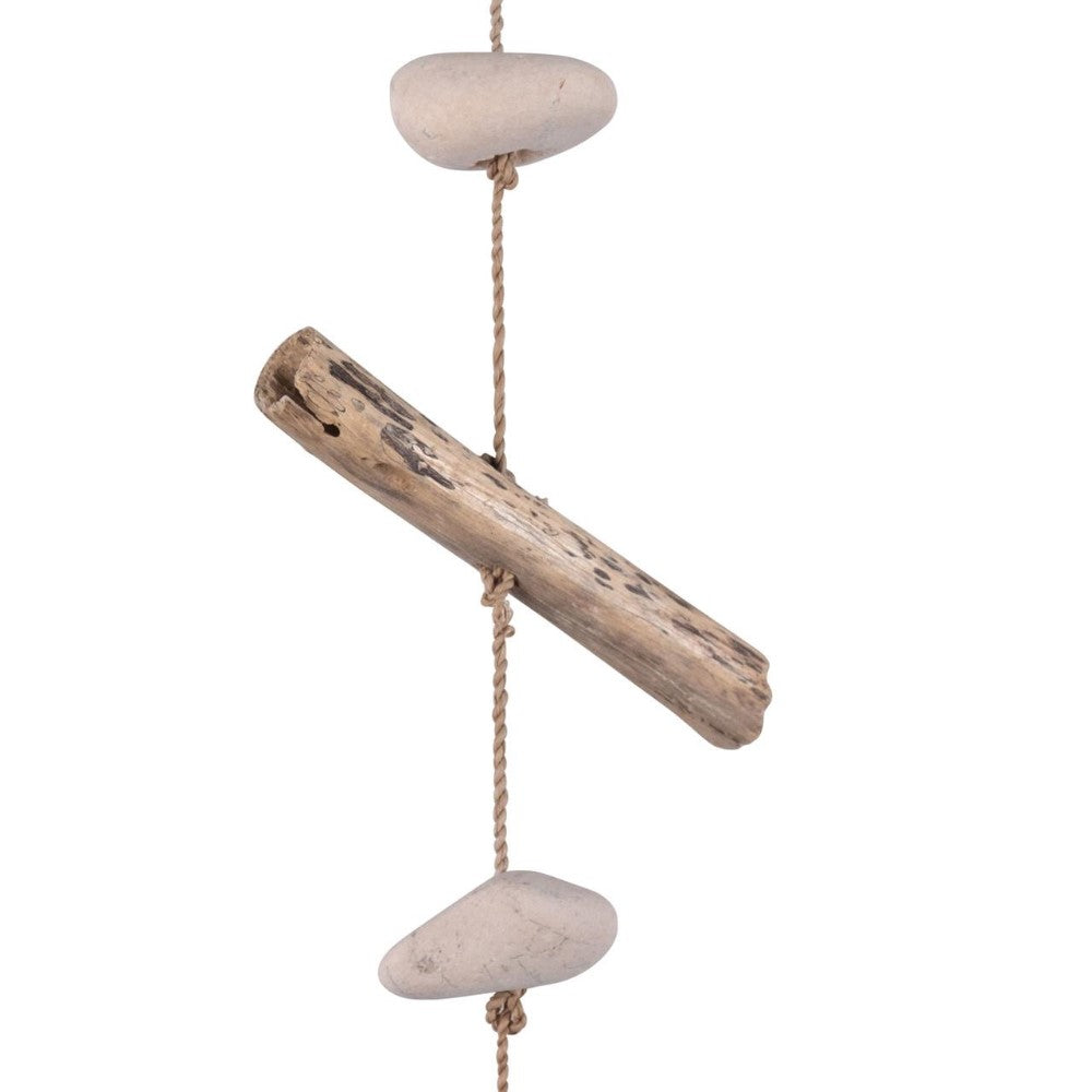 Wooden log and stones on a rope, minimalist decor.