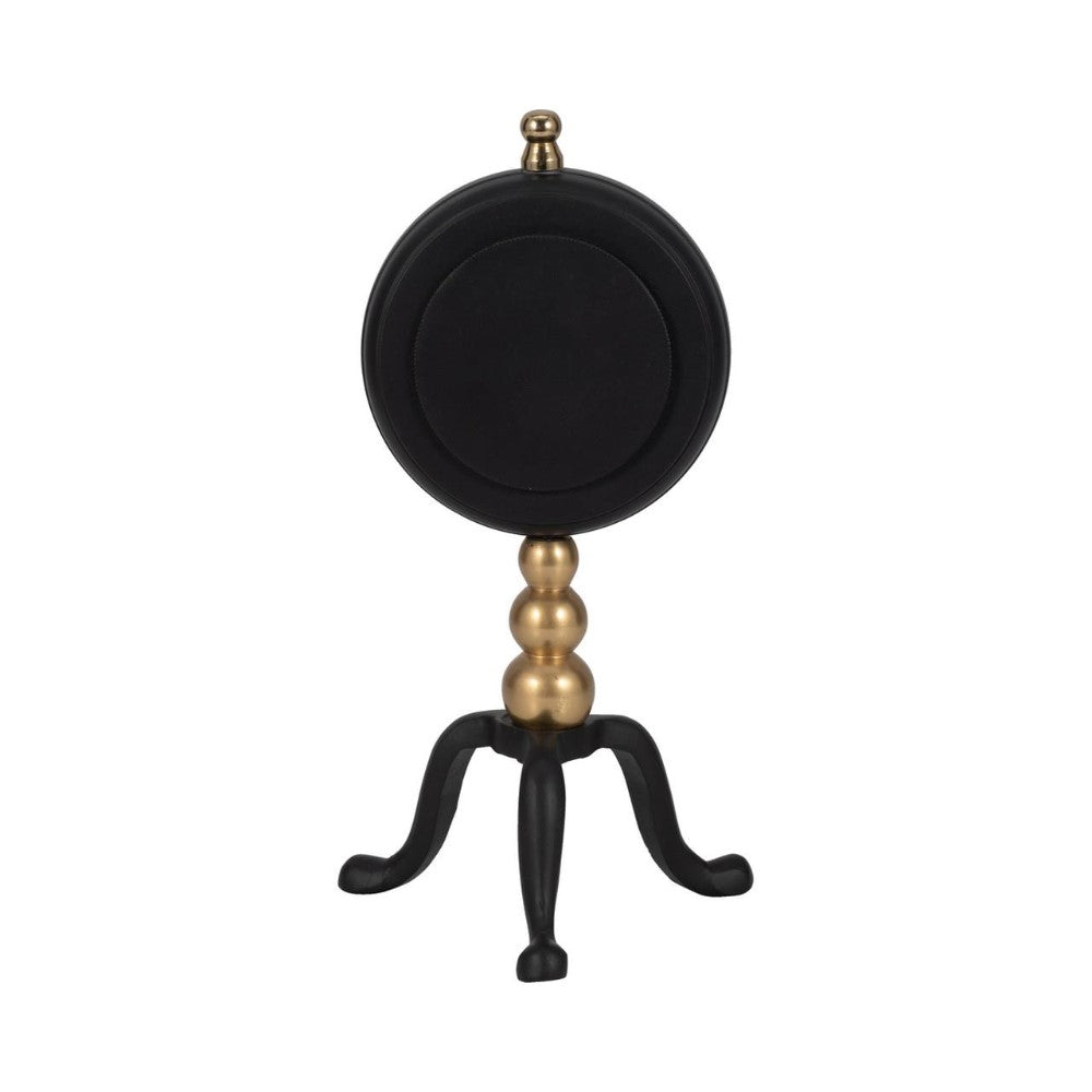 Elegant black and gold pedestal with three legs and a round top.