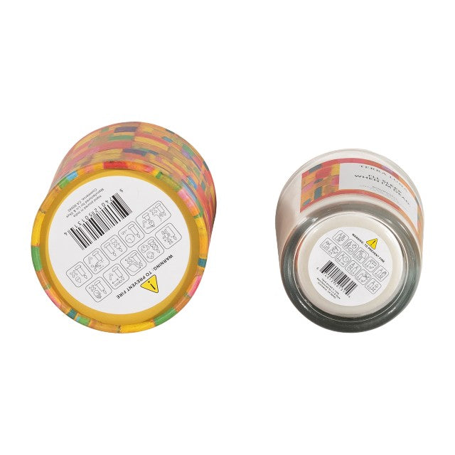 Two candles with barcode labels on their bases.