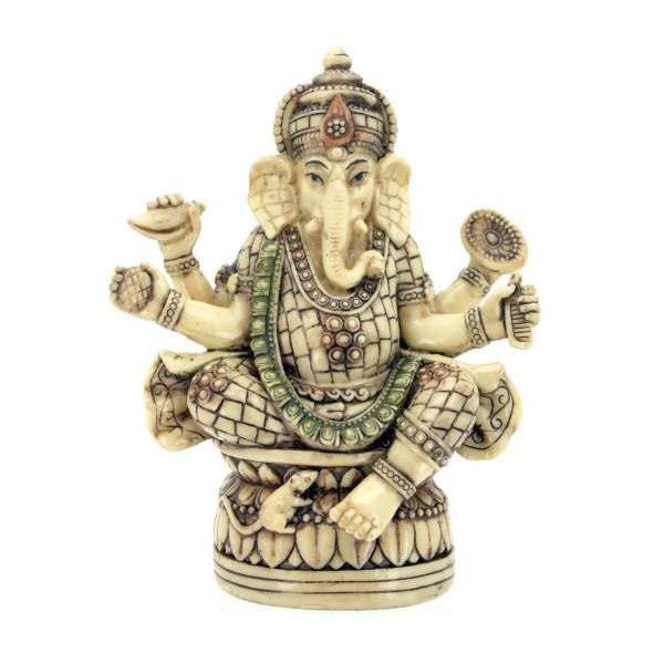 Intricately carved Ganesha statue with multiple arms and detailed ornaments.