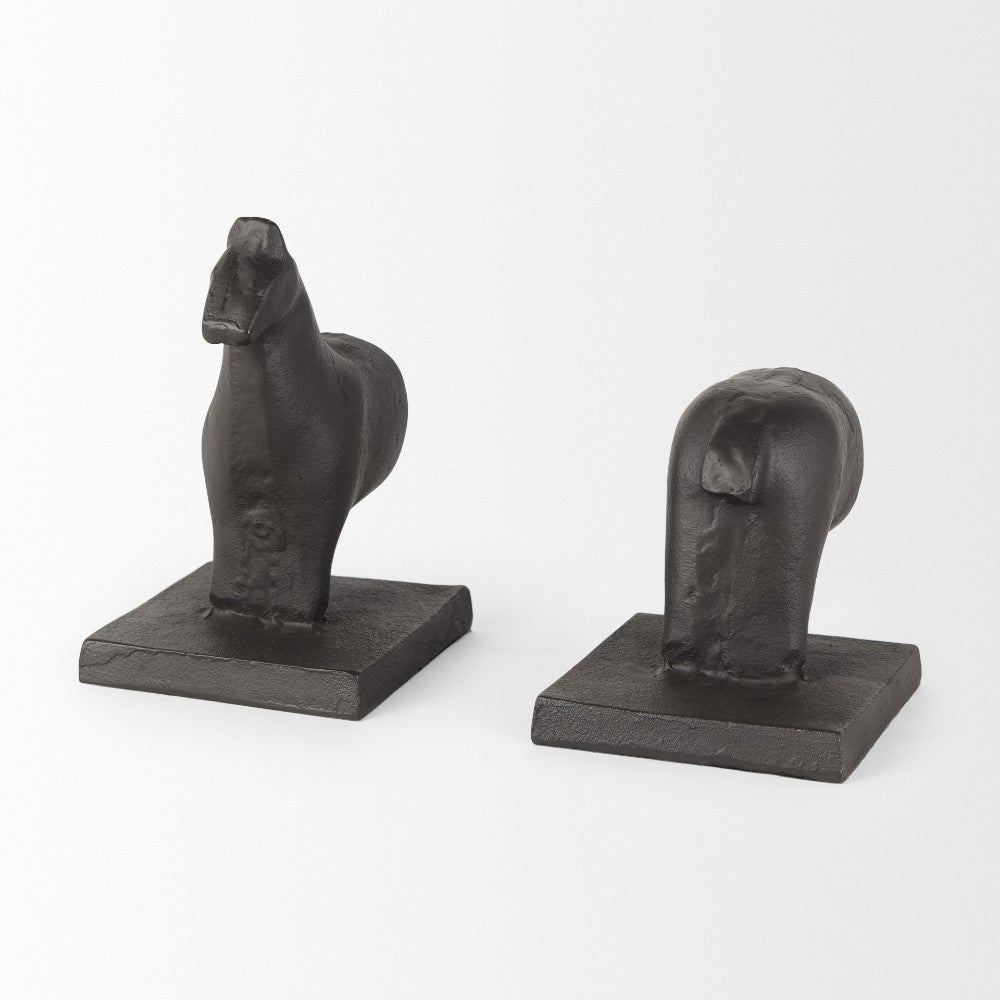 Two abstract black horse sculptures on square bases.