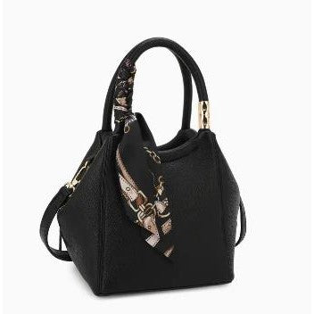 Black handbag with gold accents and a decorative scarf.