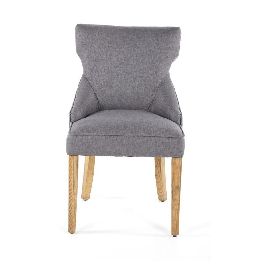 Gray upholstered chair with light wooden legs.