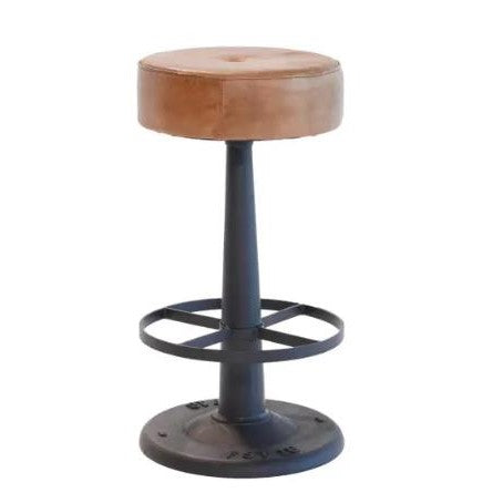 Industrial metal stool with a round brown leather seat.