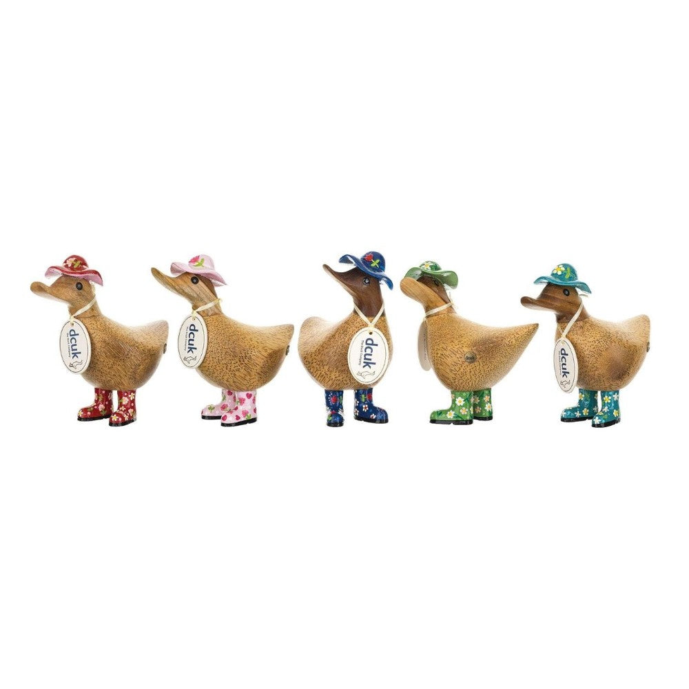Wooden ducks in hats and boots, each with a unique colorful design.