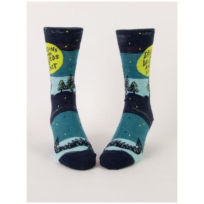 Blue socks with trees and forest-themed design, whimsical text on the top.