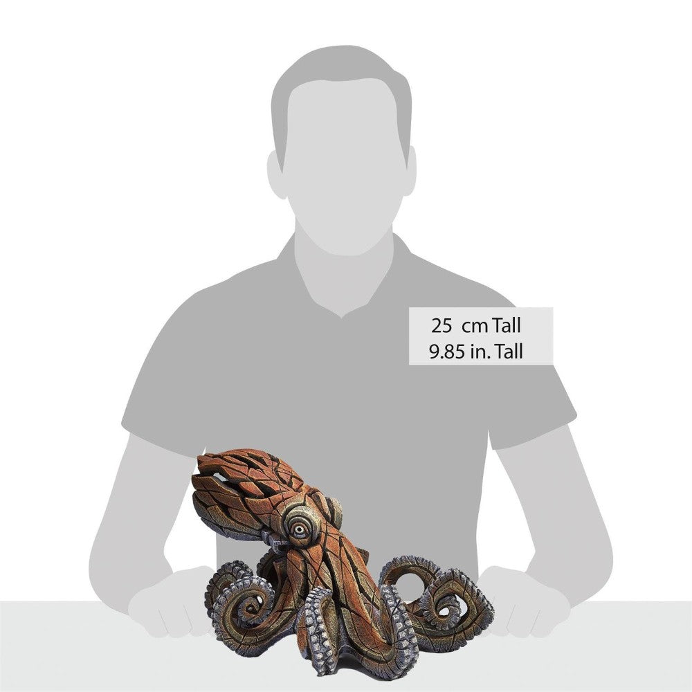 Octopus sculpture, 25 cm tall, placed in front of a silhouette.