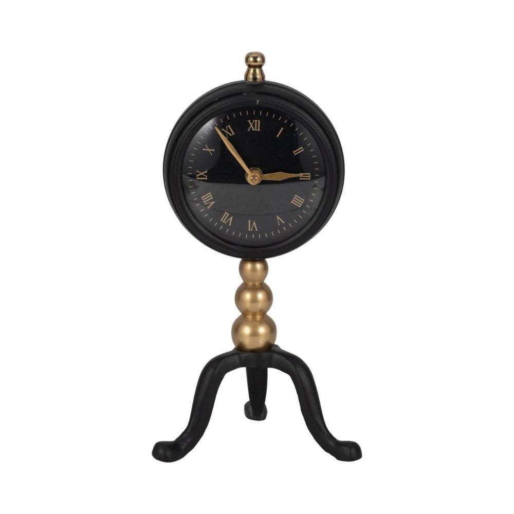 Elegant clock on a stand with gold and black details.