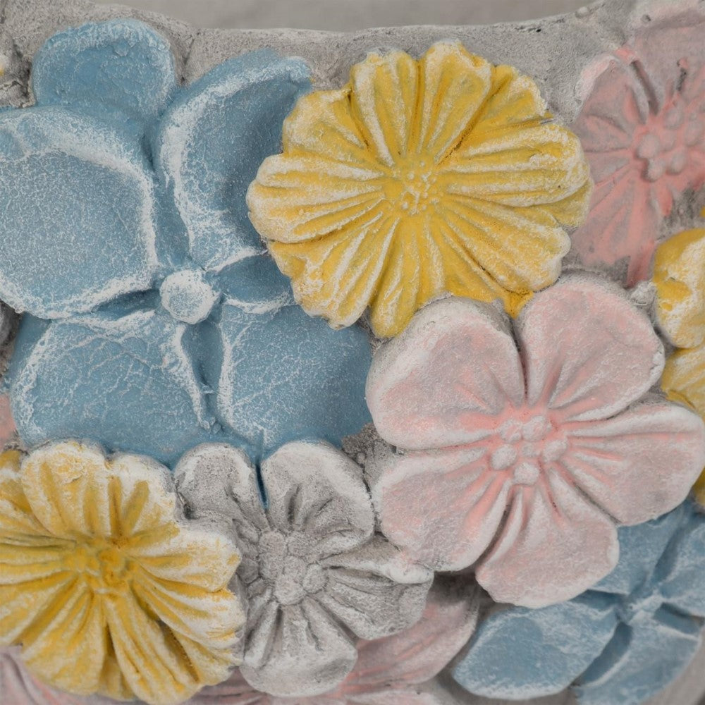 Colorful embossed floral pattern in blue, yellow, and pink.