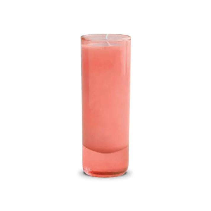 Tall pink candle in a glass container.