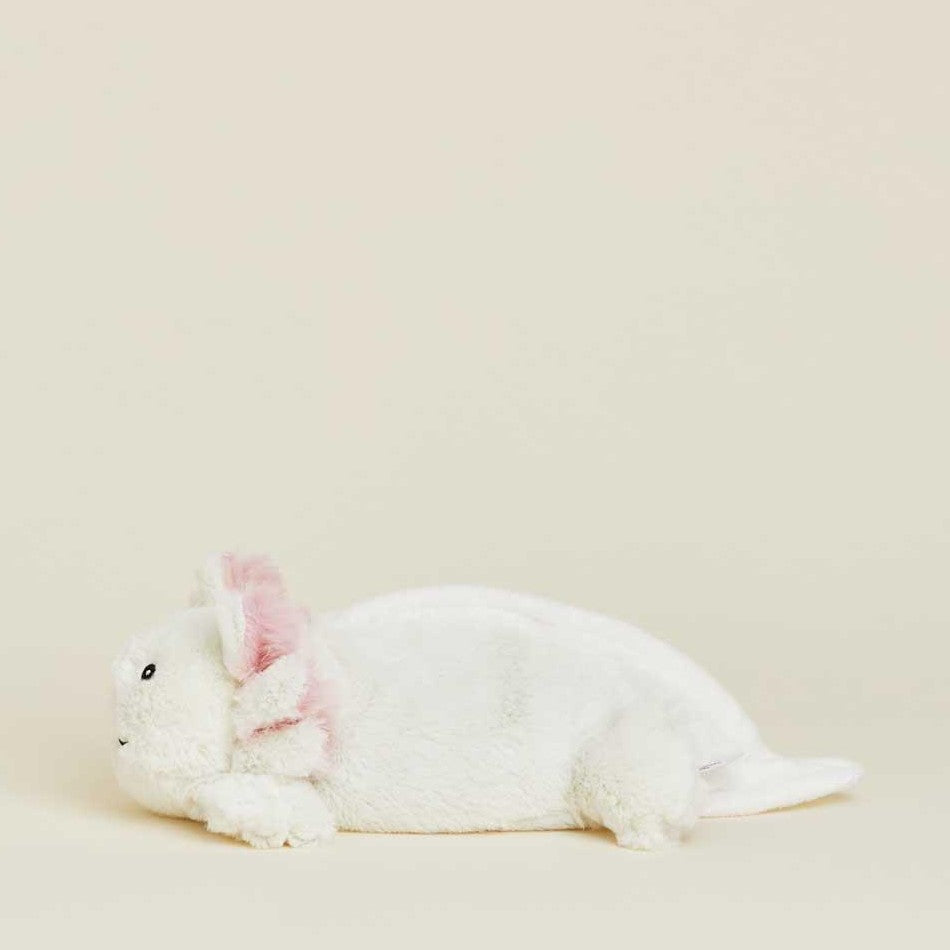 White axolotl plush toy with pink gills on a light background.