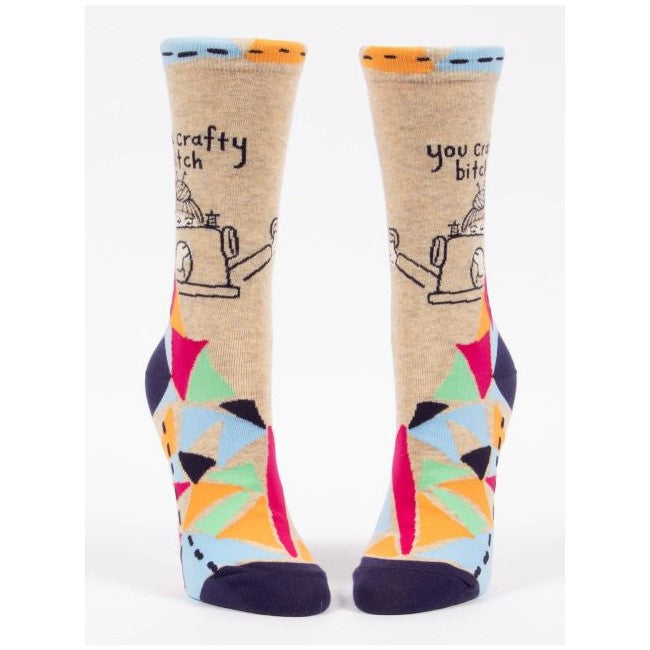 Colorful socks with sewing machine and playful text design.