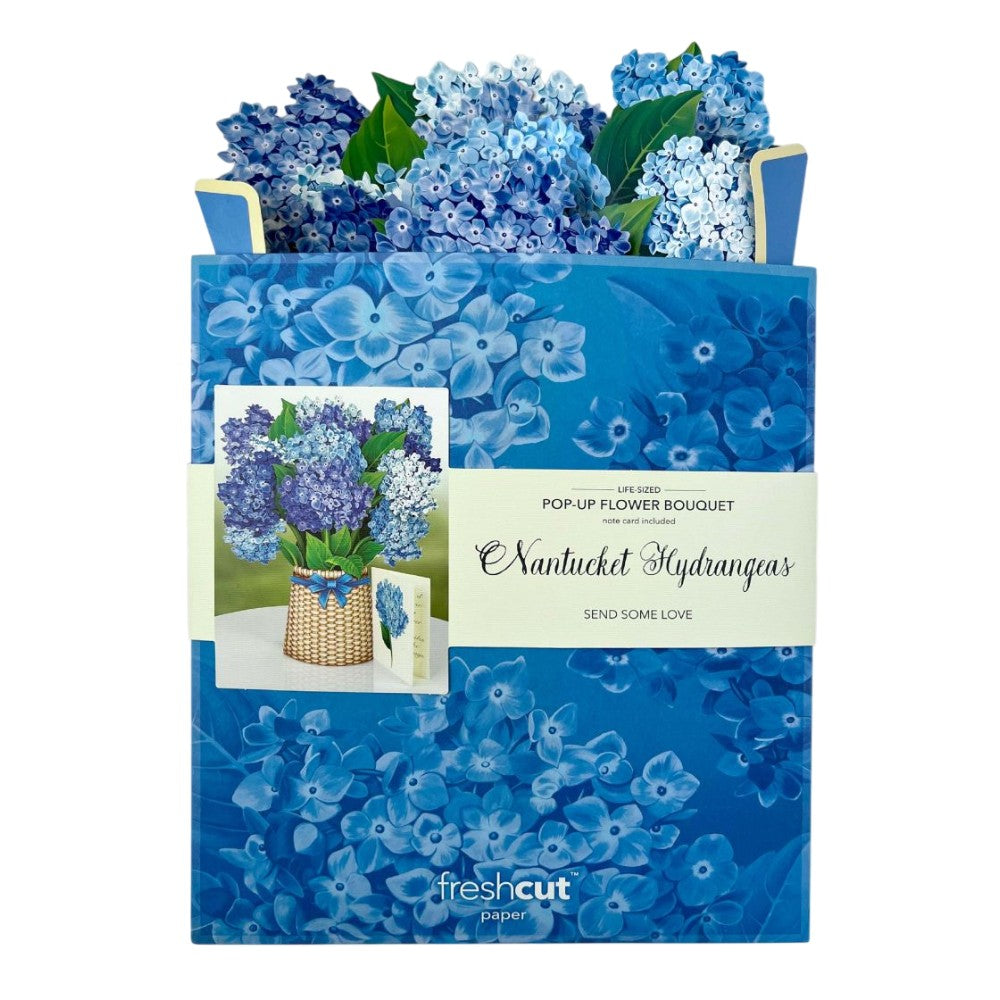Pop-up bouquet of blue hydrangeas in a floral-themed packaging.