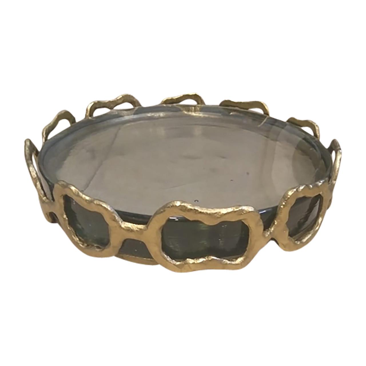 Gold metal rim glass tray with abstract design.