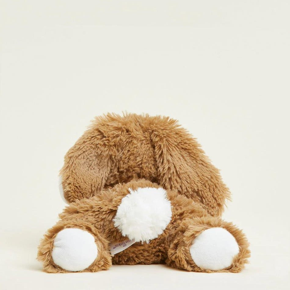Fluffy brown stuffed bunny with a white tail.