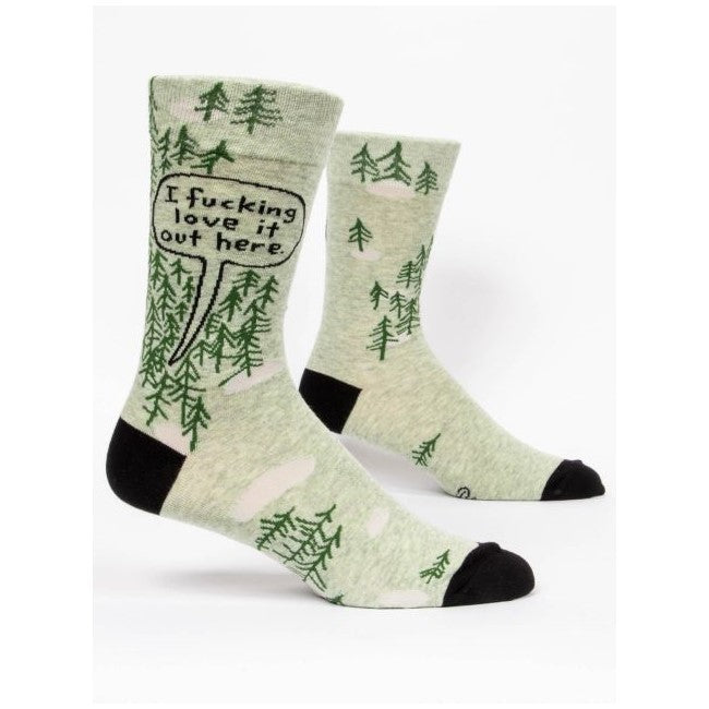 Green socks with trees and a speech bubble expressing love for nature.