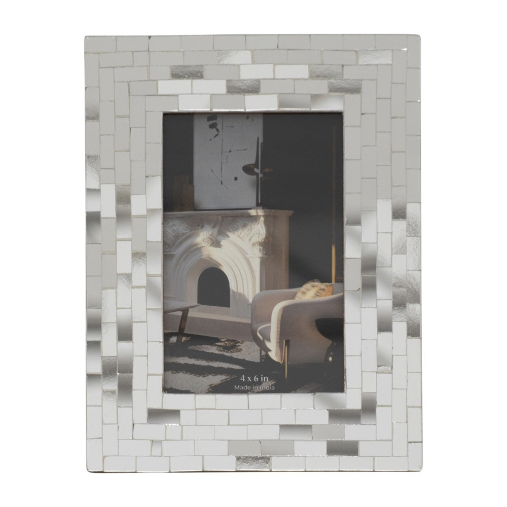 Silver mosaic photo frame with a classic interior image inside.