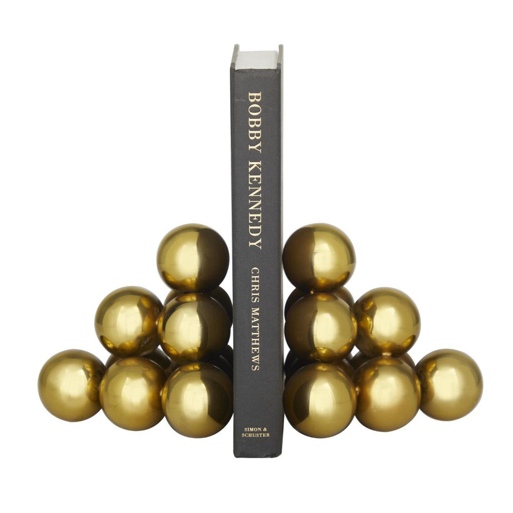 Book with golden sphere bookends.