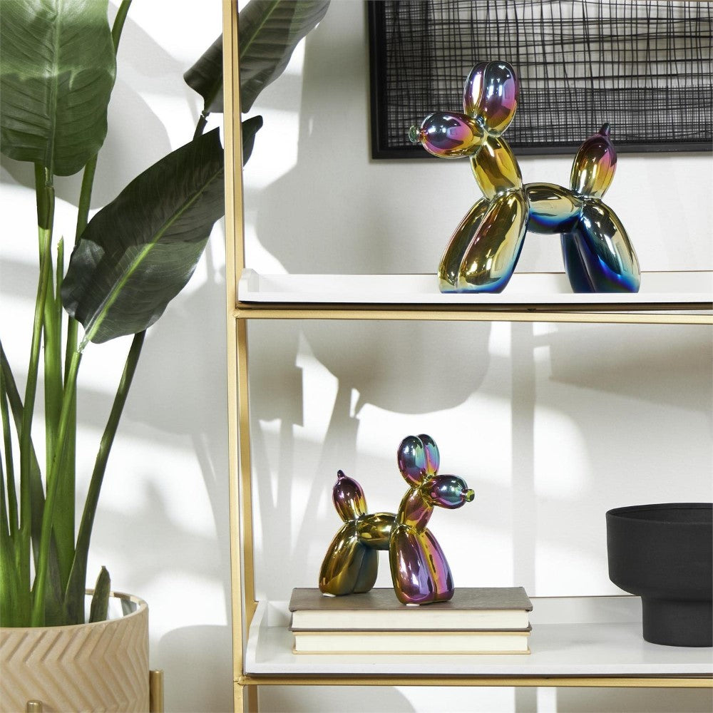 Metallic balloon dog figures on shelves with plants.