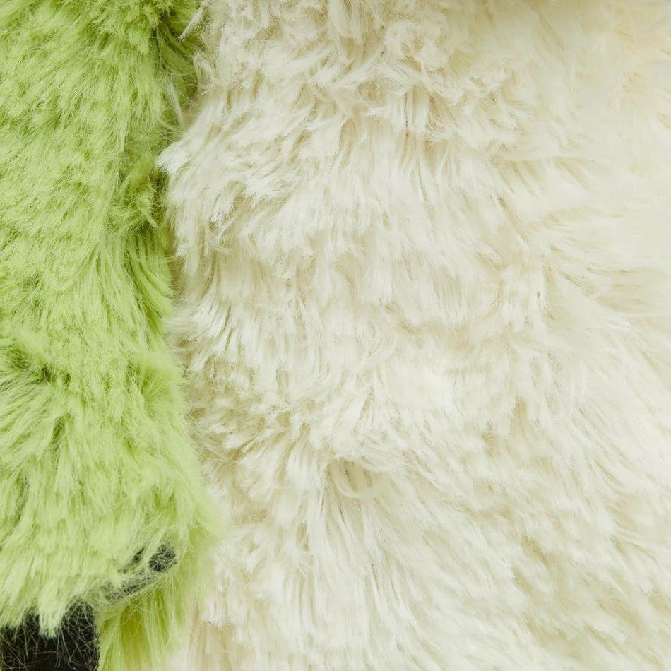 Green and cream plush textured surface close-up.