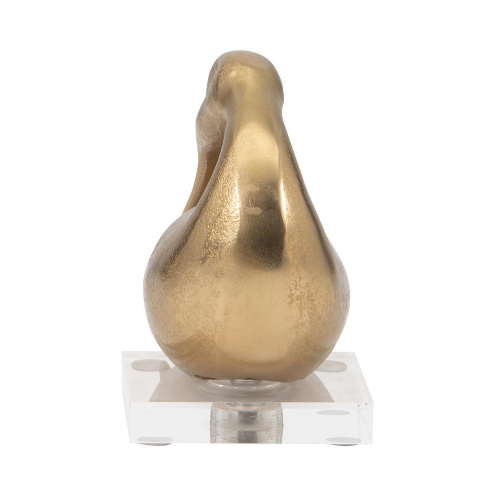Golden pear sculpture on a transparent base.