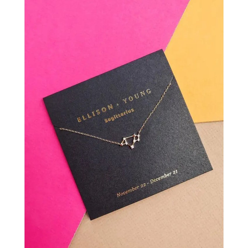 Sagittarius constellation necklace on colorful background.