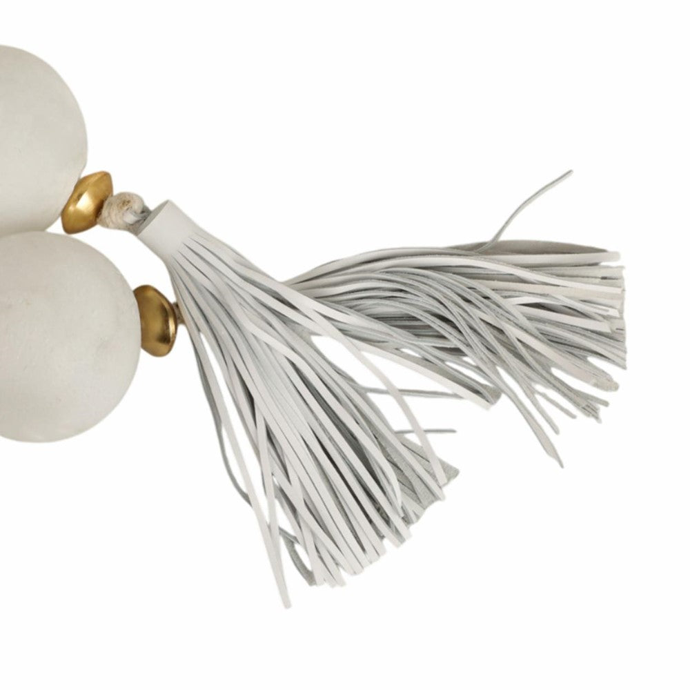 White tassel with gold accents and round beads.