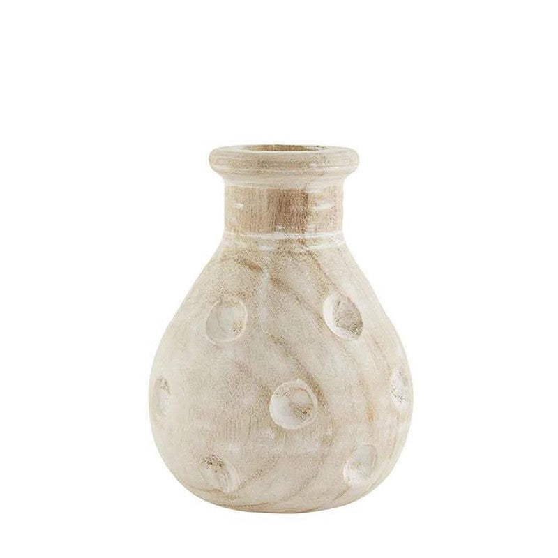 Beige textured vase with swirl design and small dots.