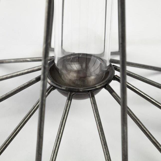 Glass vase with metal spokes radiating outward.