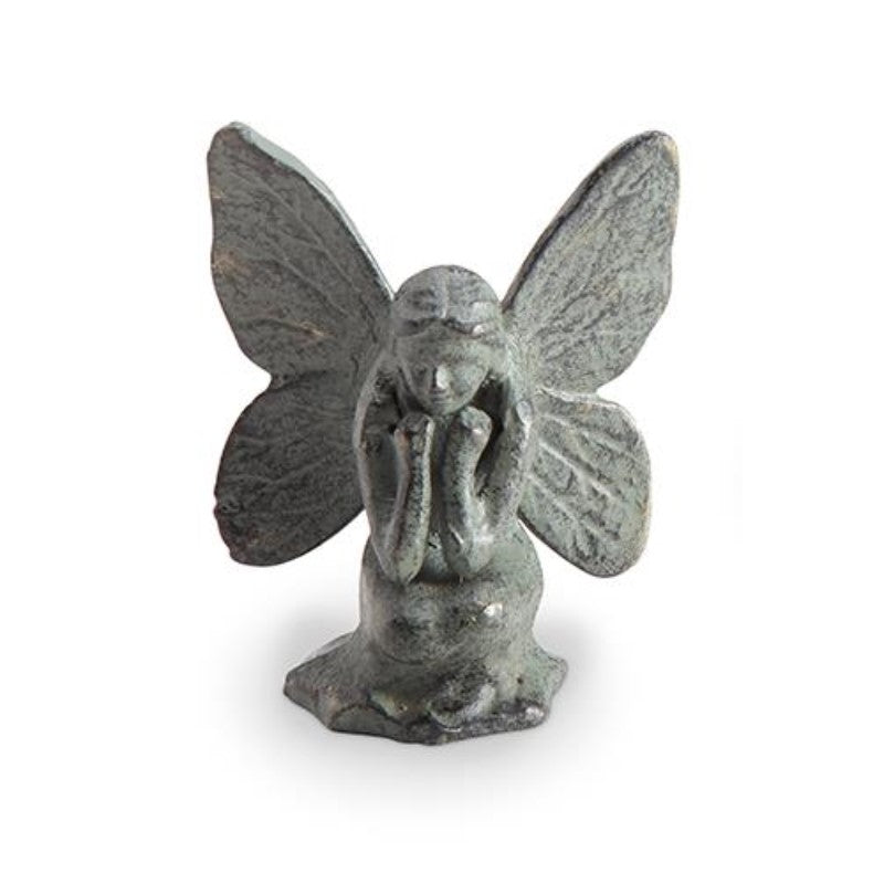 Stone fairy figurine with large wings.