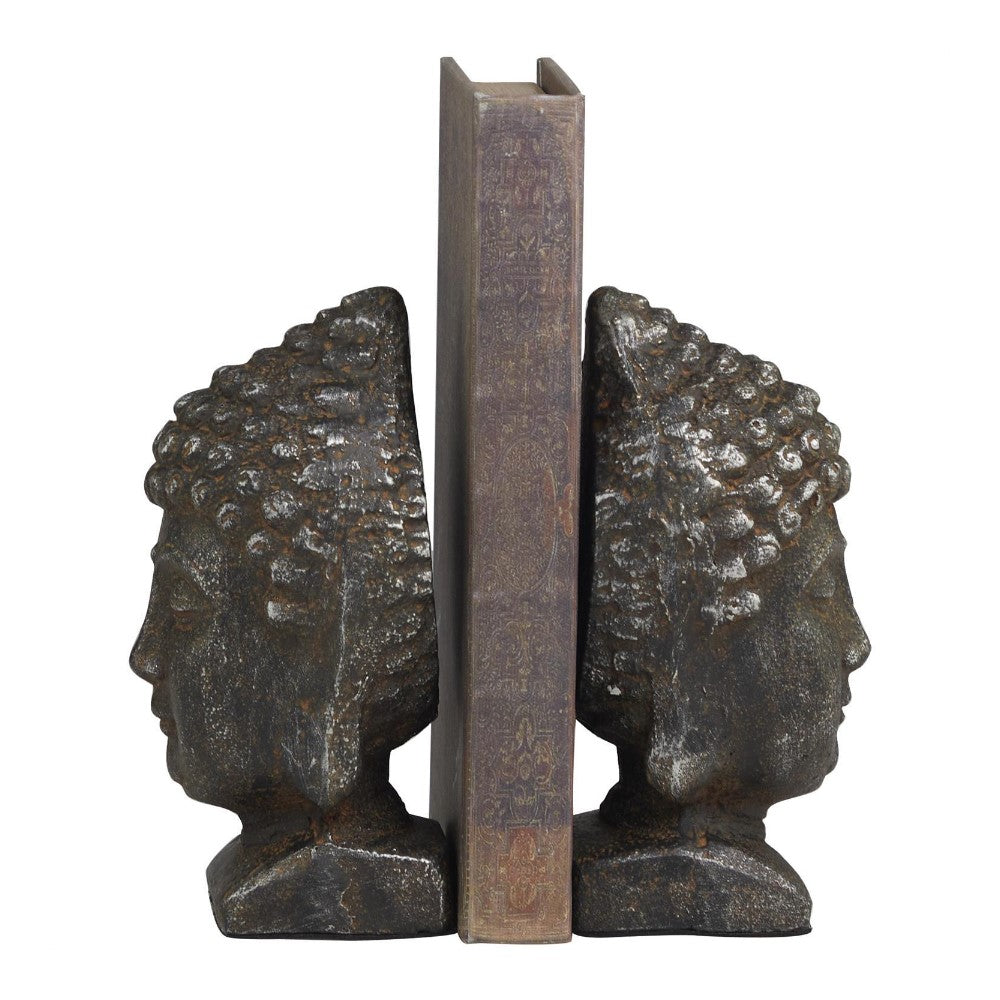 Buddha bookends holding an ornate book upright.