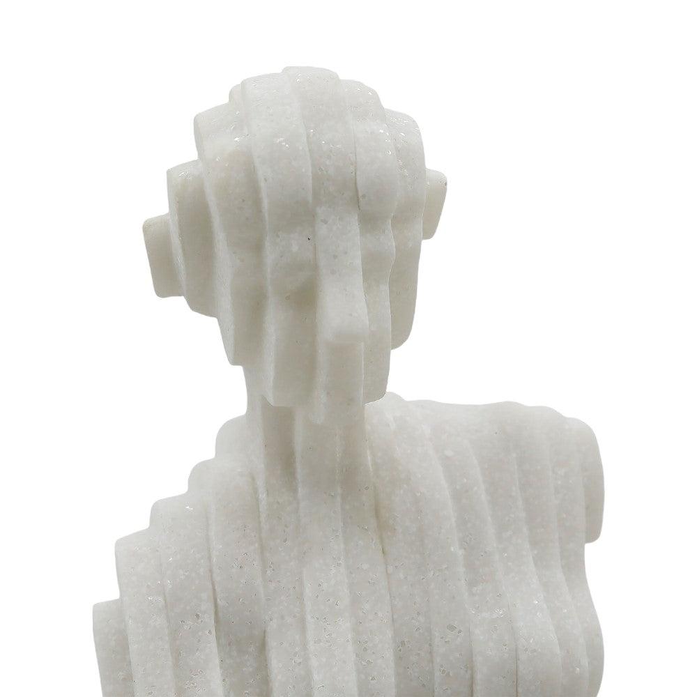 Abstract layered sculpture resembling a human bust in white stone.