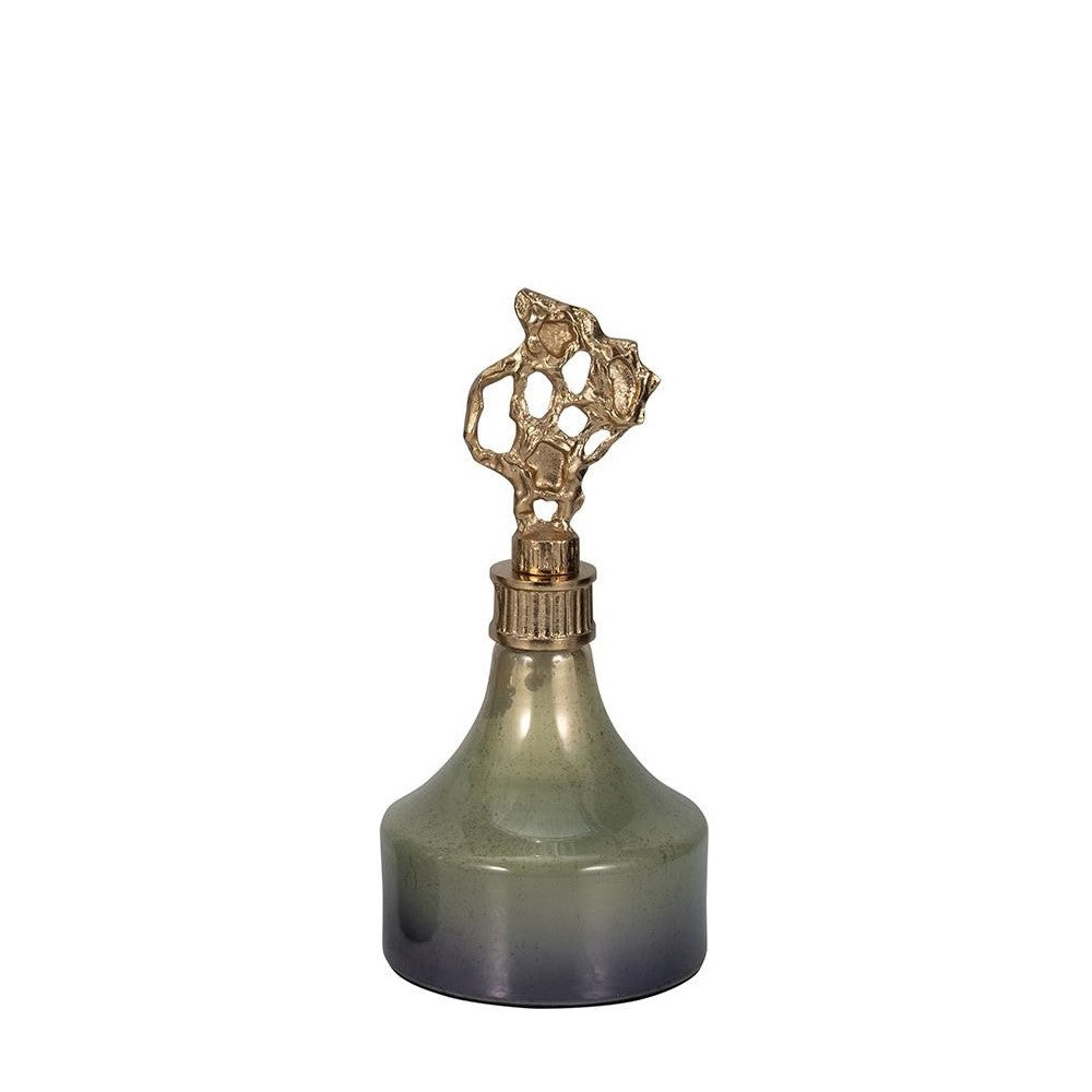 Elegant perfume bottle with abstract golden cap.