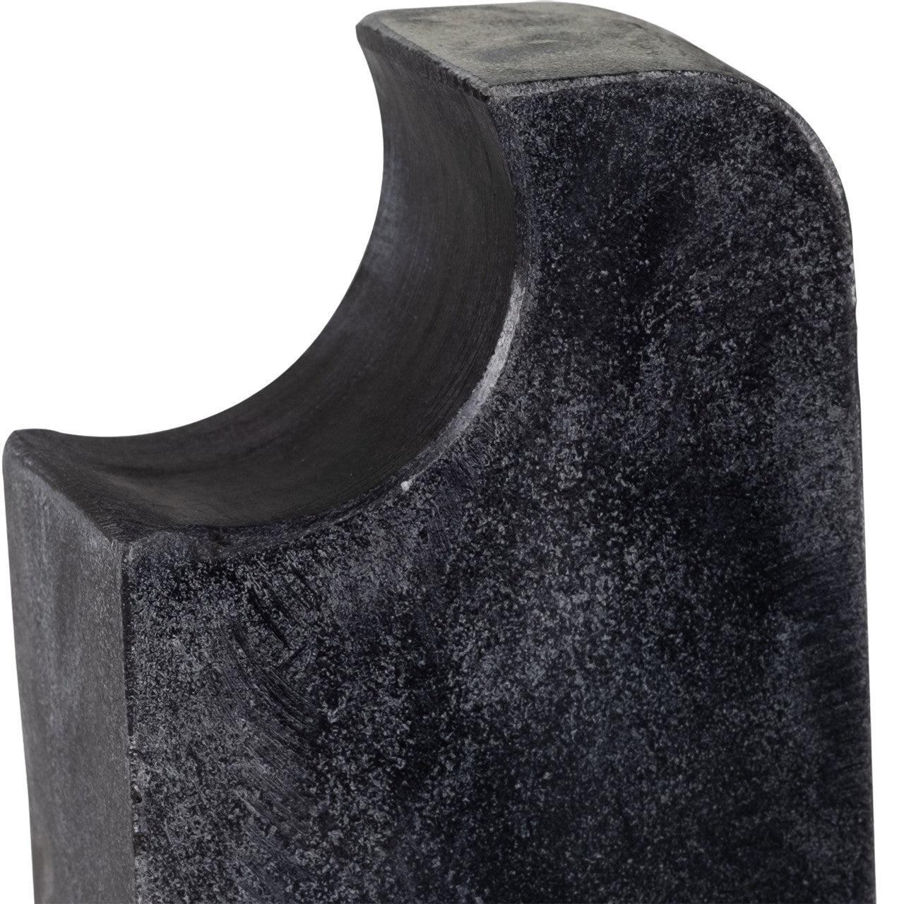 Close-up of a textured, curved dark stone surface.